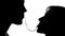 Silhouettes of woman and man eating spaghetti and kissing tenderly on date