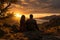 Silhouettes of a young couple admiring beautiful view on sunset. Man and woman looking at scenic evening landscape