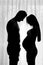Silhouettes of young future parents.