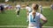 Silhouettes of young girls playing on the field in flag football. The female team preparing for the competition and