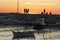 Silhouettes of young people at sea jetty