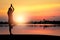 Silhouettte of women doing yoga in park