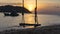 Silhoute of swing on the beach with sunset and sea,mountains view in Pho Quoc island