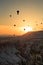 Silhoutte of balloon on sunrise. famous hot air balloon flying over valley. Goreme, Cappadocia