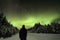 Silhoutte of a man watching the Northern Lights Aurora Borealis