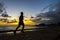 Silhoutte of runner jogging along Waikiki beach