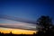 Silhoutte of tree and islands at far with vivid color of the sky during sunset