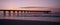 Silhoutted Ocean Pier at Sunrise