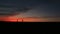 Silhouttes of the happy running couple. The man is running after his loving woman over the bright colourful sky.