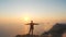 Silhuette Young Woman arms outstretched observing a beautiful dramatic sunset above a sea from a high mountain in Crimea