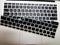 Silicon laptop keyboard cover raised to show underlying laptop isolated keys