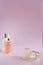 Silicon vacuum cuppings and defocused mochup bottles, woman body and skincare things, items for cellulite, on pink empty