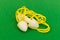 Silicone reusable ear plugs for human ears on green background