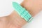 Silicone strap aquamarine color on the female wrist