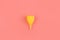 Silicone yellow menstrual cup. Women\\\'s health and alternative hygiene on a pink background flat lay