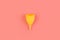 Silicone yellow menstrual cup. Women\\\'s health and alternative hygiene on a pink background flat lay