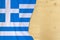 Silk colored national flag of Greece country, empty wooden mocap for text, concept of tourism, travel, emigration, global business