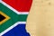 Silk colored national flag of South Africa, wooden blank for text, concept of tourism, travel, emigration, global business,
