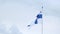 Silk national flag with coat of arms of European state of Finland flutters in wind in blue sky, concept of tourism, economy,