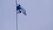 Silk national flag of European state of Finland flutters in the wind in the blue sky, concept of tourism, economy, politics,