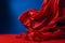 Silk Red Cloth Blowing on blue Background generative AI