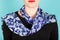 Silk scarf. Blue scarf around her neck on white background.