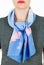 Silk scarf. Blue silk scarf around her neck on white background.