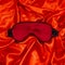 Silk sleep mask on silk background