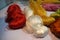 Silk yarns in different raw colors on the table.