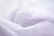 Silky fabric curve shape fashion white cloth abstract background with Beauty soft waves textured. luxury textile material purple