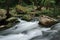 Silky river flow near waterfall known as Santa Margarida