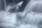 Silky, turbulent water of a small waterfall in Hebron, Connecticut