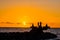 Sillhouette of people in the beach during sunset