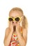 Silly blond girl smiling putting on her sunglasses