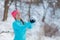 Silly girl playing with snow