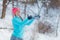 Silly girl playing with snow