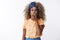 Silly and playful african-american blond girl with afro hair in stylish headband, orange t-shirt, squeez lips making