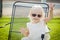 Silly Playful Toddler Girl Wearing Sunglasses Outside at Park