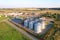 Silo storage at farm. Elevator for storage siliage and grain. Feed Silos Hopper for the storage of wheat and barley. Hay for