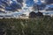 Silo at sunrise with blue sky with clouds