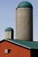 Silos and red and green barn