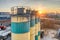 Silos for storage of cement aerial view. Evening shooting, the setting sun.