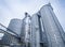 Silos for storage of grain, silo roof close-up. Warehouse of wheat cereals. View from bottom