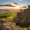 Silouette od photographer in nice mountain sunset with green forest