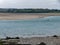 Silt on the exposed seabed at low tide. The shallow sea bay