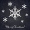 Silver 3D snowflakes on the dark winter and New Year background with snowflake silhouettes.
