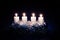 Silver advent candles burning religious concept