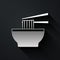 Silver Asian noodles in bowl and chopsticks icon isolated on black background. Street fast food. Korean, Japanese