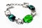 Silver bangle with brilliants and green stones
