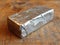 silver bar closeup wooden background